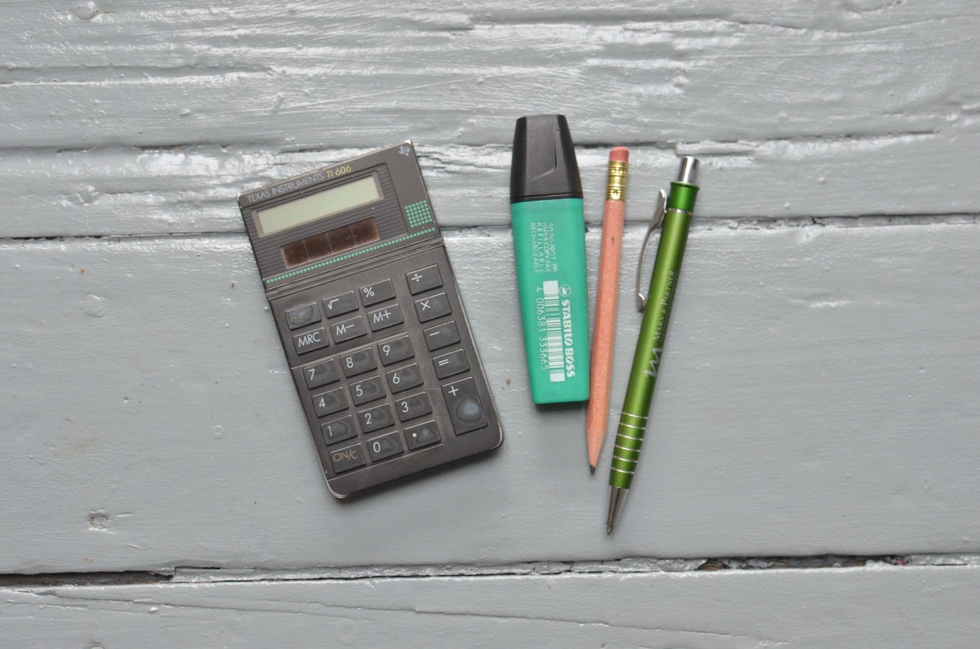 Calculator and stationery used for recurring monthly bookkeeping